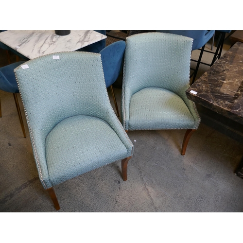 1629 - A pair of turquoise upholstered side chairs with studwork