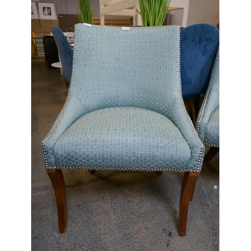 1629 - A pair of turquoise upholstered side chairs with studwork