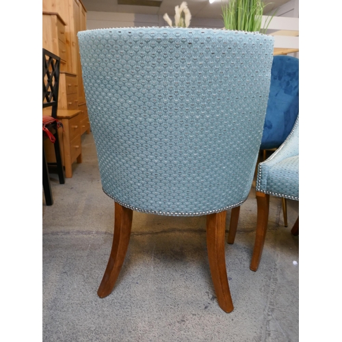 1629 - A pair of turquoise upholstered side chairs with studwork