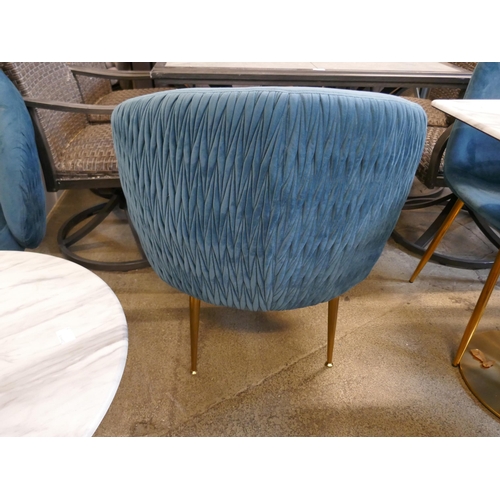 1633 - A low circular coffee table, marble effect, with two blue velvet tub chairs