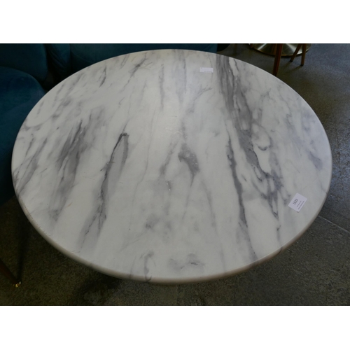 1633 - A low circular coffee table, marble effect, with two blue velvet tub chairs