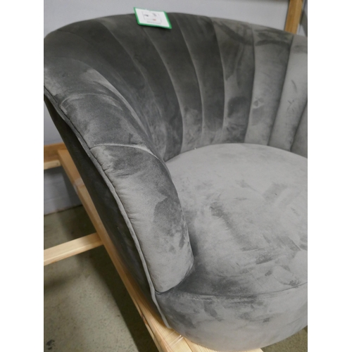 1643 - A pewter velvet shell back armchair - missing legs