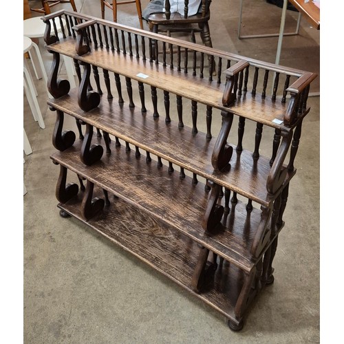 67 - A Regency style hardwood wall hanging bookcase