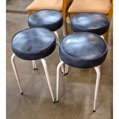 59A - A set of four white tubular metal and blue vinyl seated circular stools