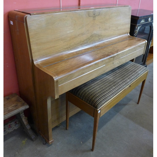 101 - A teak upright piano with faux ivory keys and a piano stool