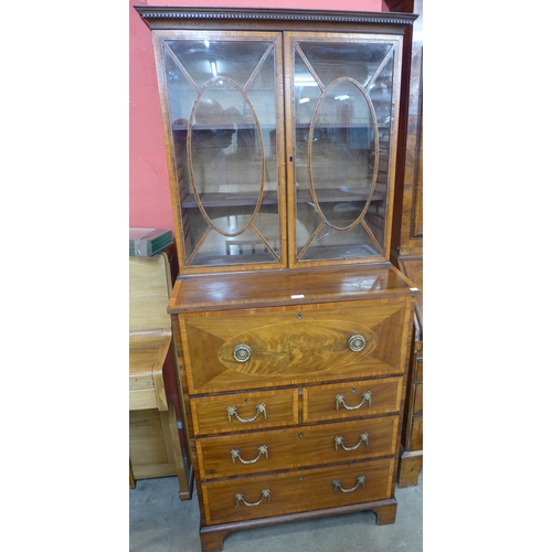 102 - A Regency inlaid mahogany secretaire bookcase