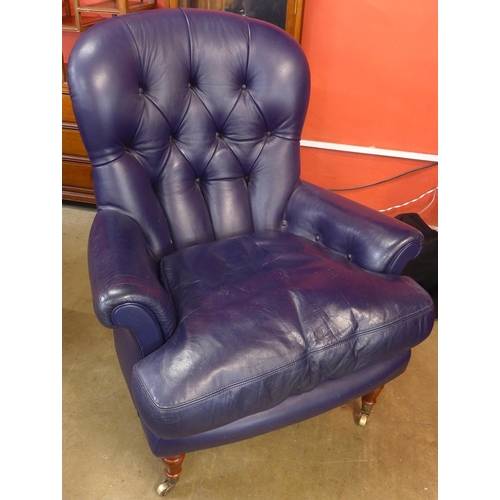 106 - A Victorian style mahogany and blue leather upholstered  armchair