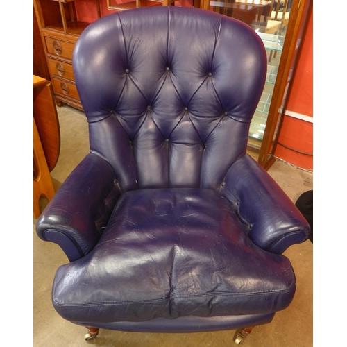 106 - A Victorian style mahogany and blue leather upholstered  armchair