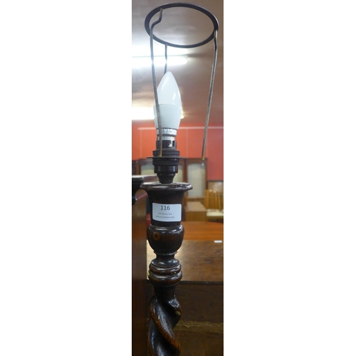 116 - An oak barleytwist standard lamp