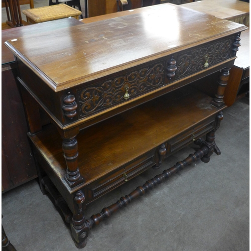 118 - A late Victorian Elizabethan Revival carved walnut two drawer buffet