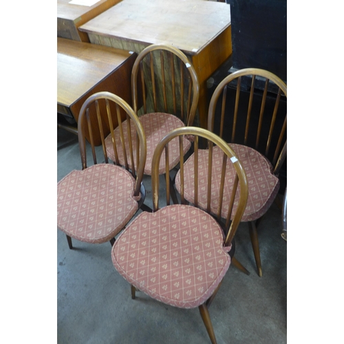 120 - An Ercol Golden Dawn elm and beech Windsor drop leaf table and four chairs