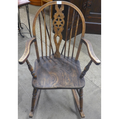 122 - A 19th Century style beech Windsor rocking chair