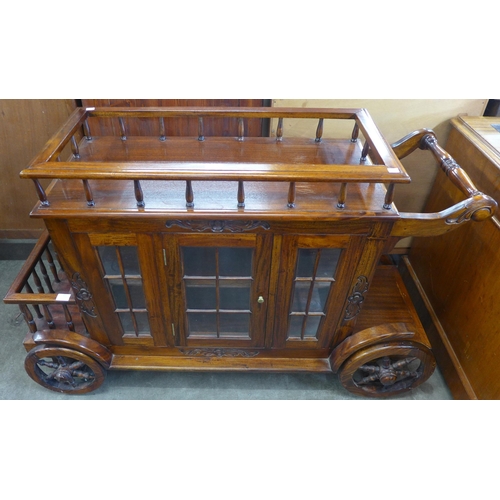 127 - A carriage shaped hardwood cocktail trolley