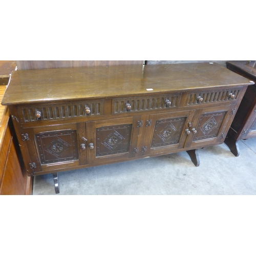 131 - A carved oak sideboard