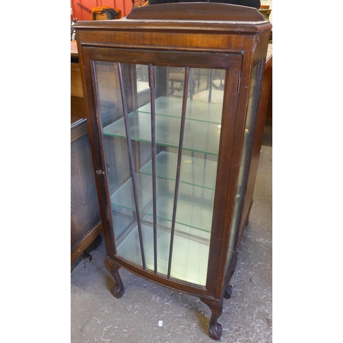 135 - An oak single door display cabinet