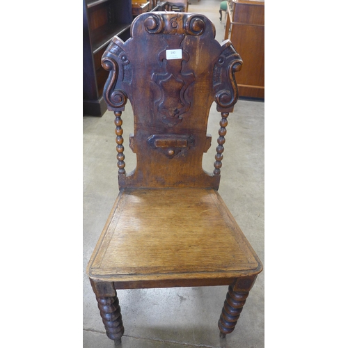 140 - A Victorian oak hall chair