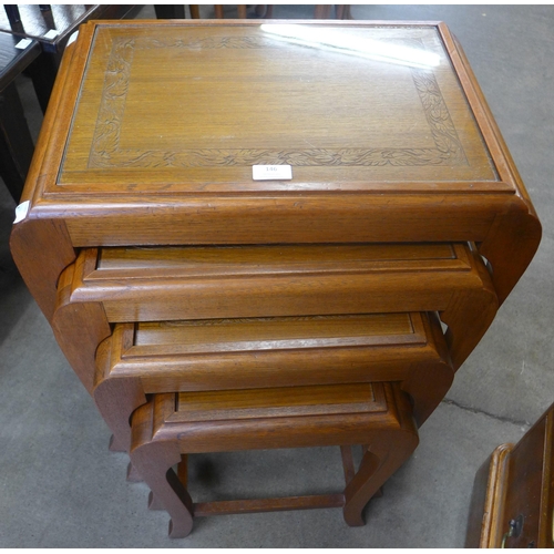 146 - An eastern carved hardwood nest of quartetto tables