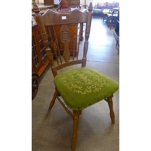 150 - A set of four American oak dining chairs