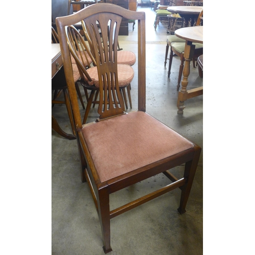 156 - A Regency style mahogany dining table and seven George IV style chairs