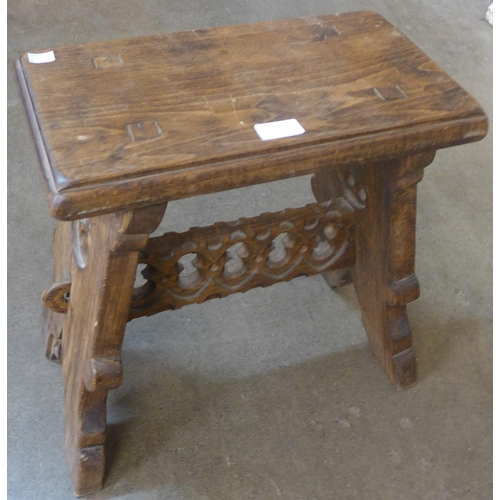 158 - A Gothic style oak stool