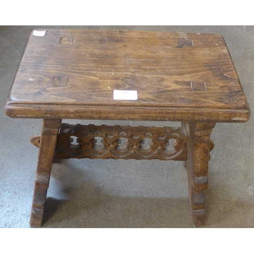 158 - A Gothic style oak stool