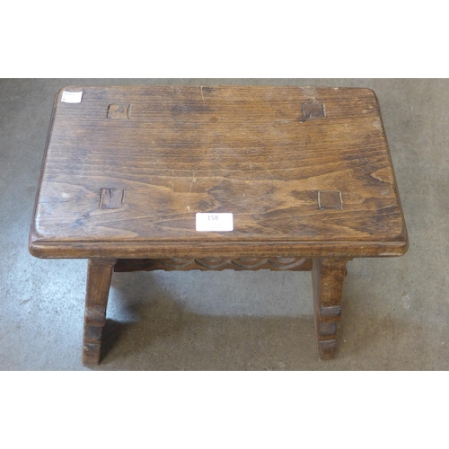 158 - A Gothic style oak stool