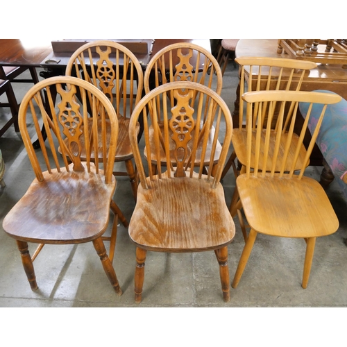 163 - A set of four beech wheelback kitchen chairs and two others