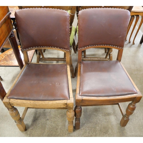 166 - An oak gateleg table and two chairs