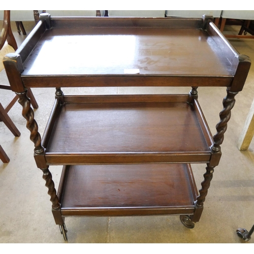 173 - An early 20th century oak barleytwist three tier trolley