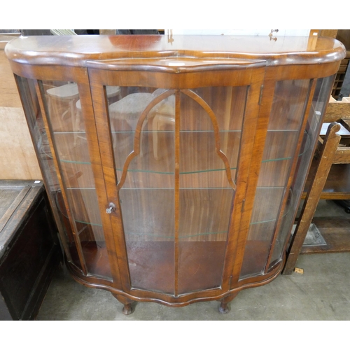 179 - A walnut single door display cabinet