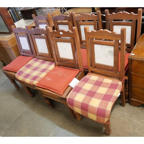 197 - An eastern hardwood and marble topped dining table and chairs