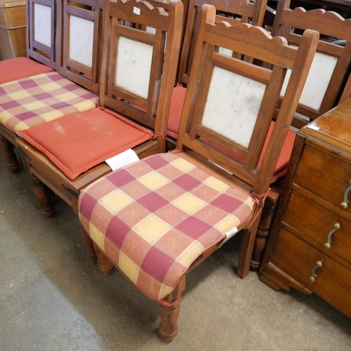 197 - An eastern hardwood and marble topped dining table and chairs