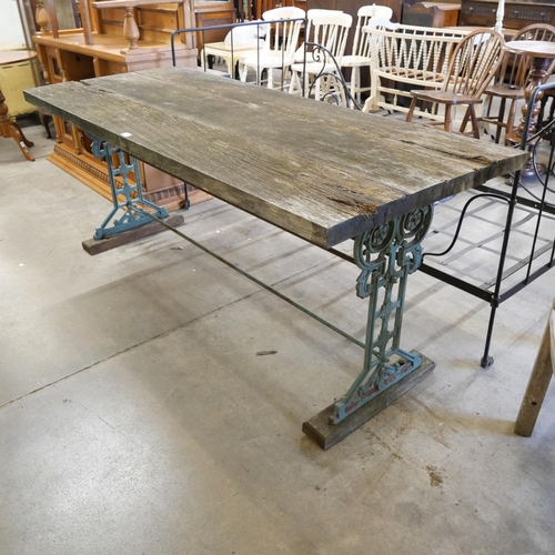 213 - A Coalbrookdale style cast iron based garden table