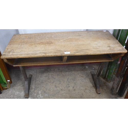 229 - An early 20th century elm child's desk and two chairs