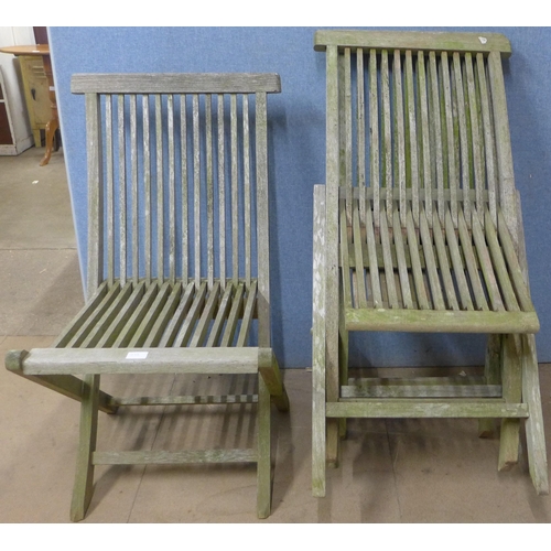 233 - Four teak folding garden chairs