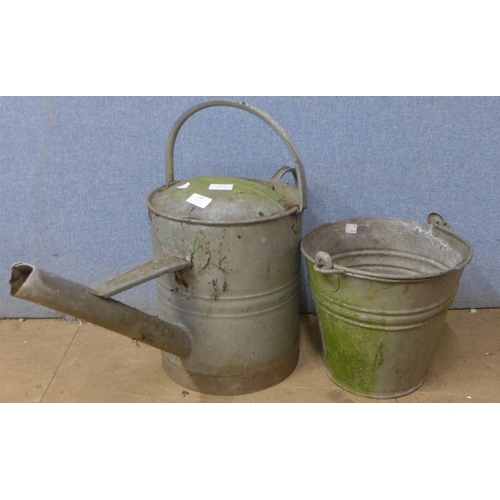 248 - A galvanised bucket and watering can