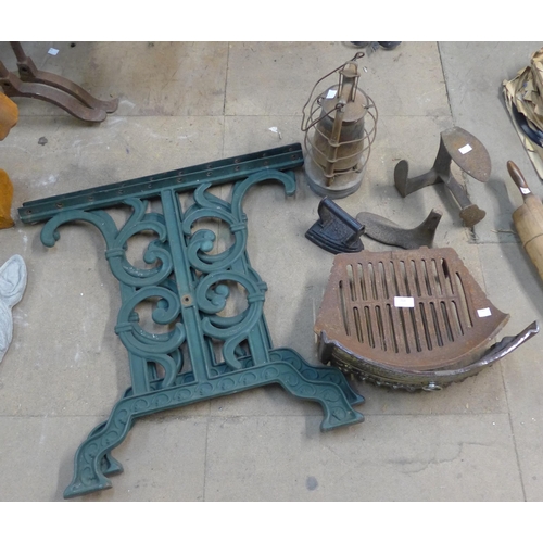 264 - A large mixed lot of metalware including wrought iron table ends, cast iron fire grate and fender, a... 