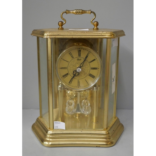 317 - A German gilt metal quartz anniversary clock and an oak mantel clock