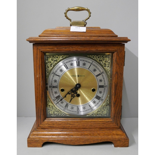 323 - A Howard Miller oak mantle clock