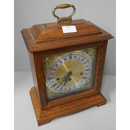 323 - A Howard Miller oak mantle clock