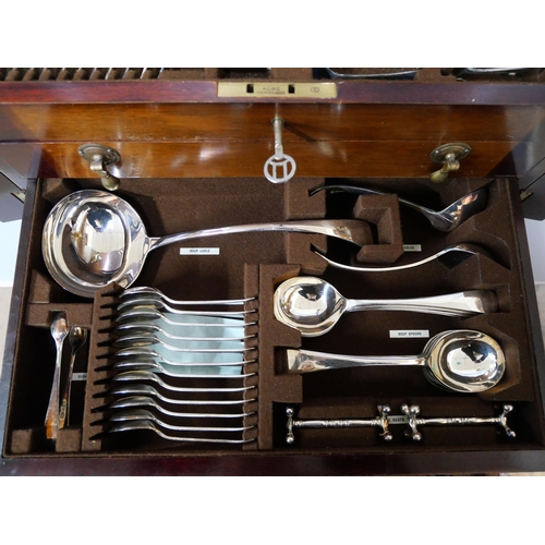 325 - An early 20th Century oak cased canteen of cutlery with faux ivory handles, including a carvery set,... 