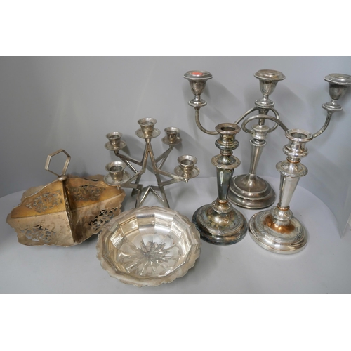 334 - A large collection of silver plate, including candlesticks, trays, goblets and cutlery, etc.