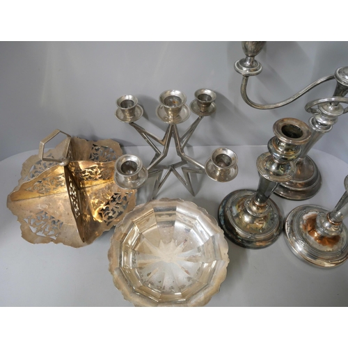 334 - A large collection of silver plate, including candlesticks, trays, goblets and cutlery, etc.