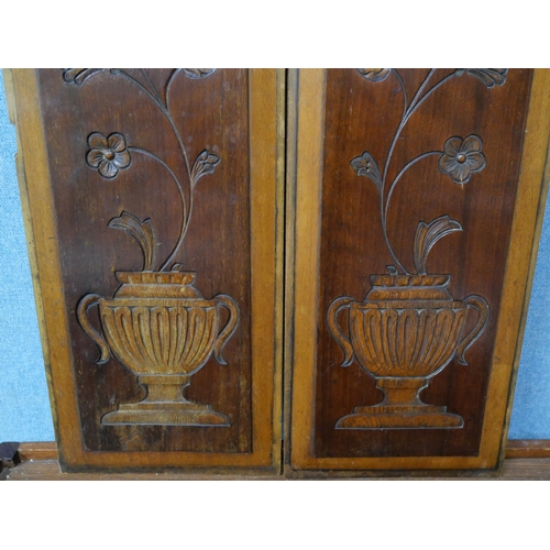 344 - Two carved wooden wall hanging panels