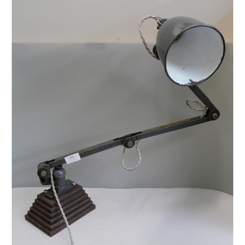 348 - An industrial green metal anglepoise lamp