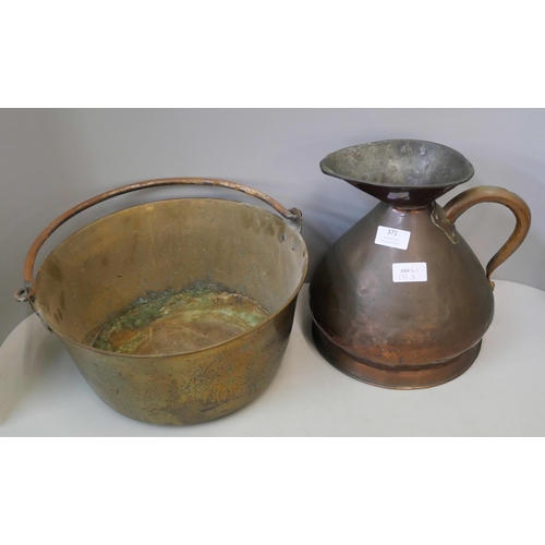 371 - A brass jam pan and a copper jug