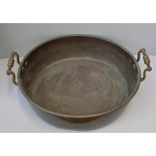 371 - A brass jam pan and a copper jug