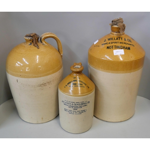 372 - Three large stoneware ewers, including Willatt & Co., Wine Merchants, Nottingham