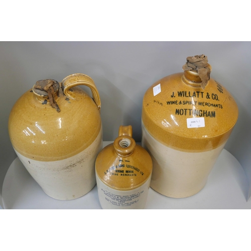 372 - Three large stoneware ewers, including Willatt & Co., Wine Merchants, Nottingham