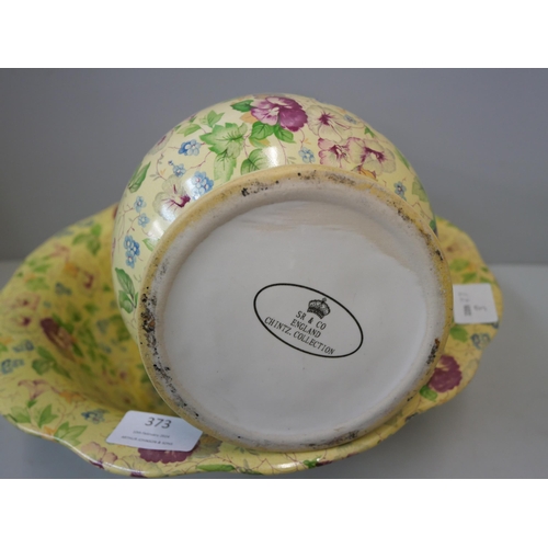 373 - A chintz porcelain wash jug and bowl